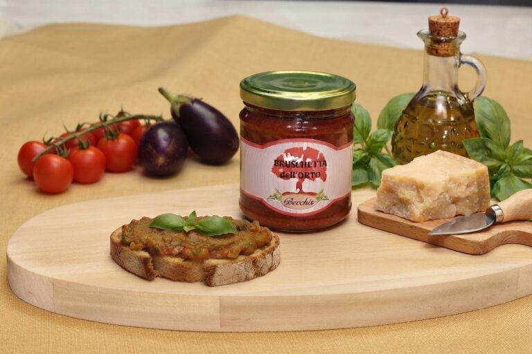 Bruschetta dell'orto con grana padano , melanzane e pomodoro